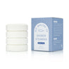 Set of shower steamers with packaging on a white background