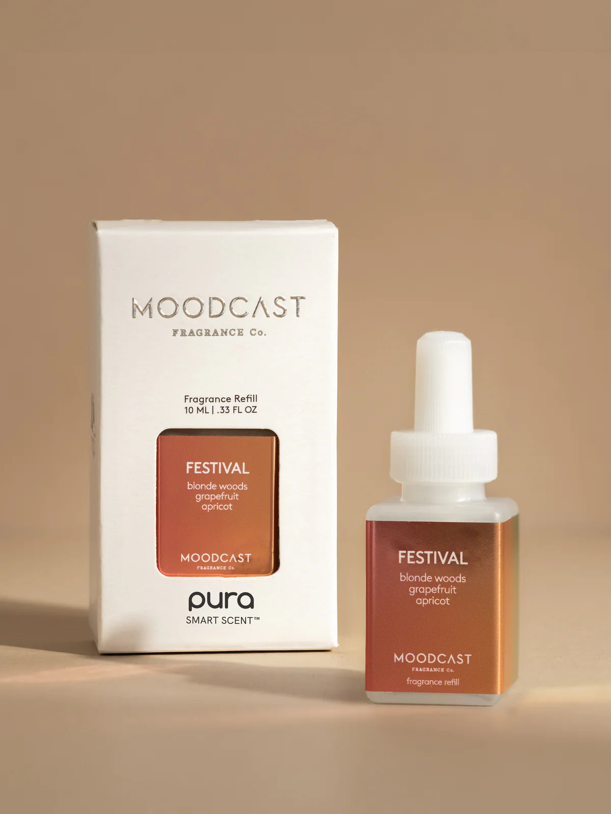 Moodcast fragrance refill bottle and packaging on a beige background