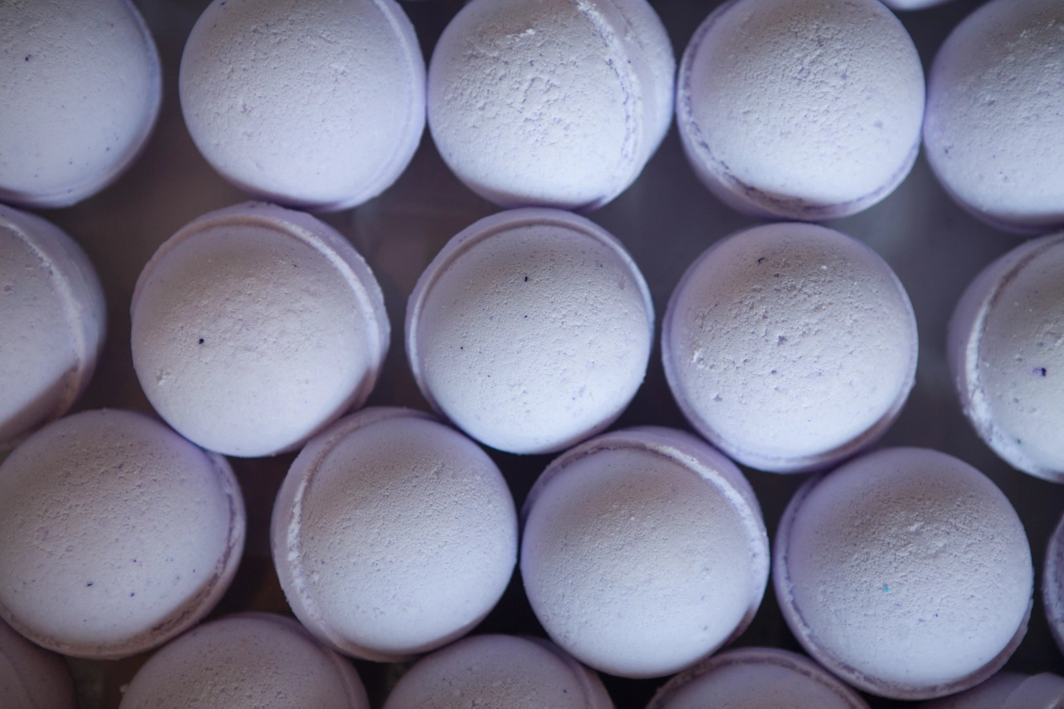 Close-up of purple bath bombs in a cardboard box