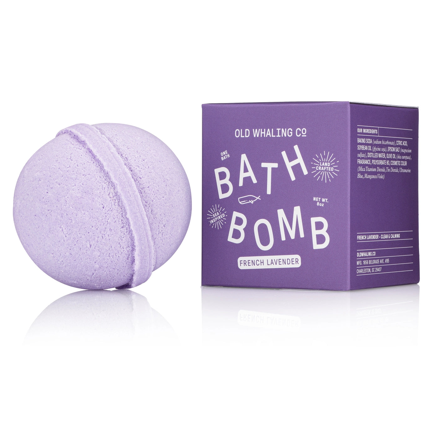 Purple bath bomb with packaging on a white background