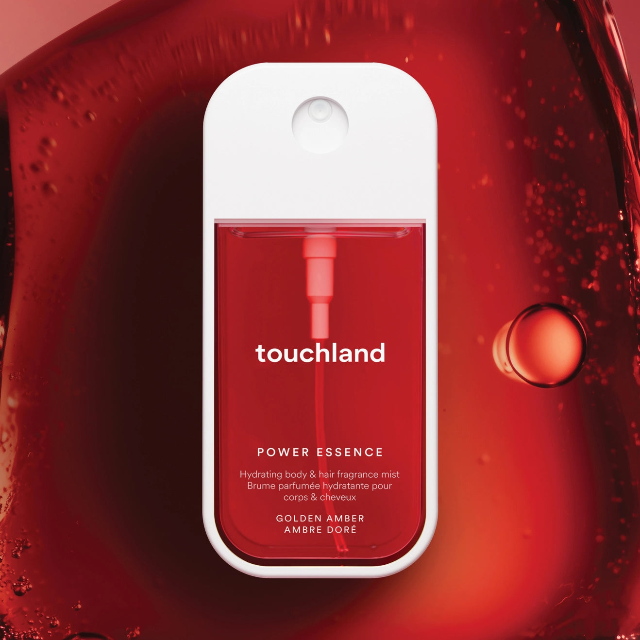Touchland power essence bottle on a red background