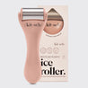 Kitsch ice roller with packaging on a light gray background