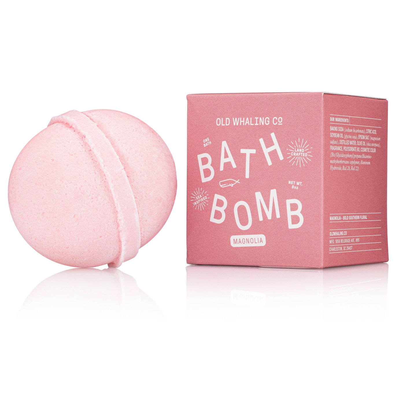 Pink bath bomb with packaging on a white background