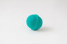 Turquoise bath bomb on a white background