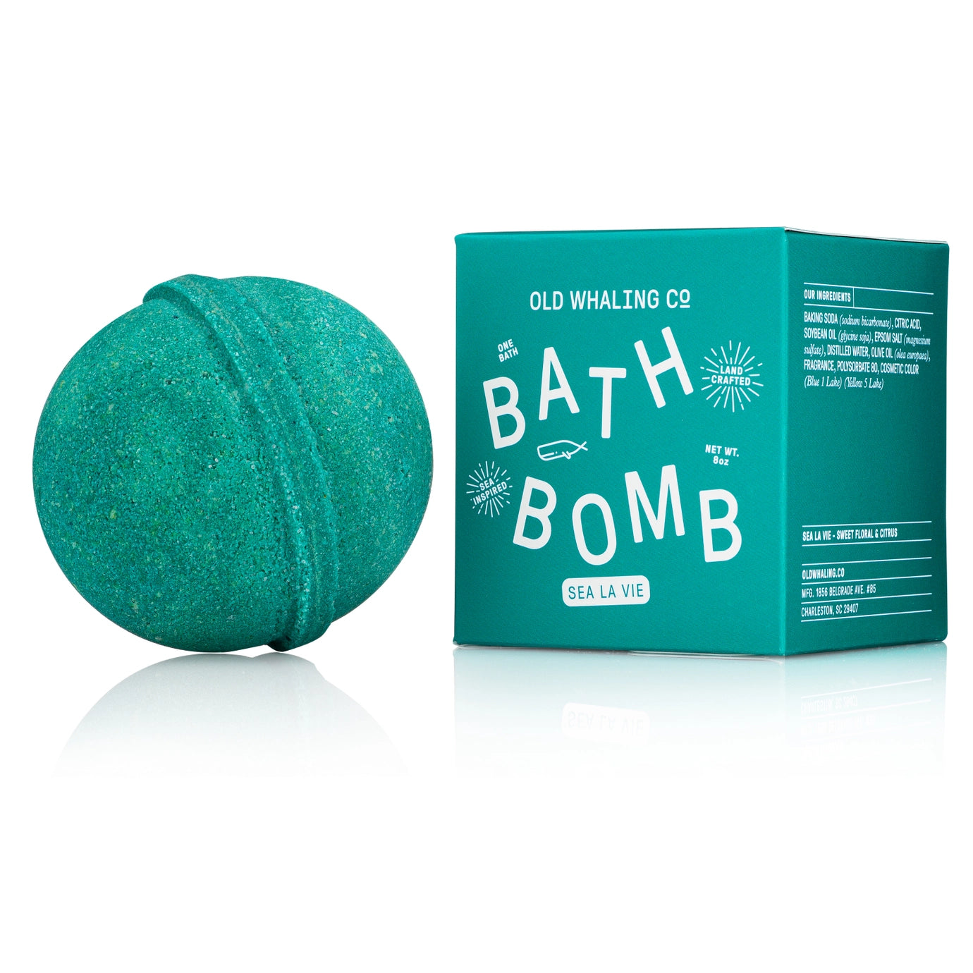 Green bath bomb with packaging on a white background