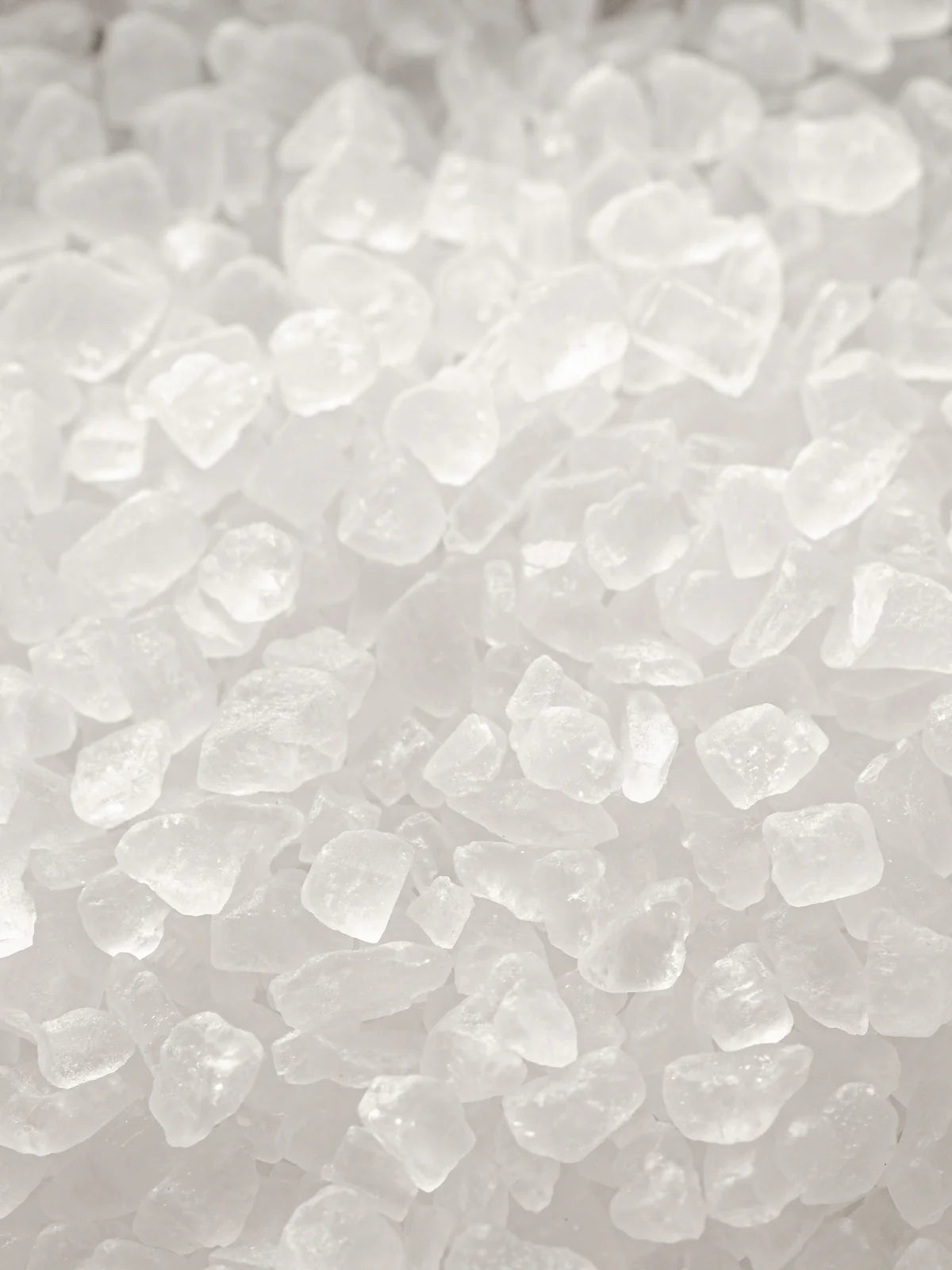 Close-up of course salt on a light gray background