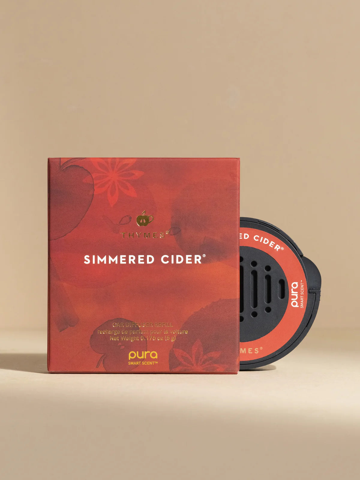 Pura Simmered Cider packaging on a beige background
