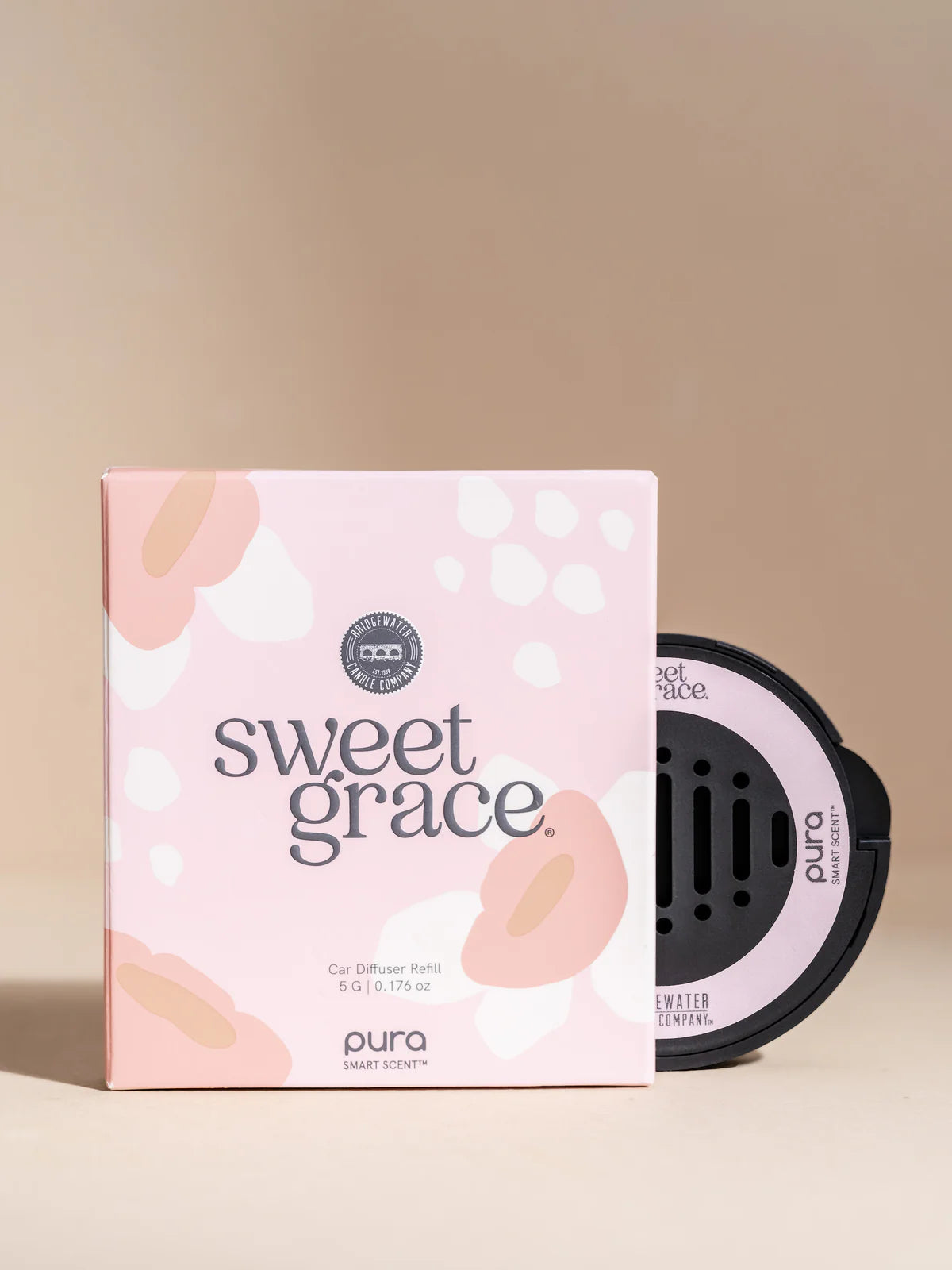 Sweet Grace diffuser bottle and packaging on a beige background