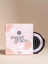 Sweet Grace diffuser bottle and packaging on a beige background