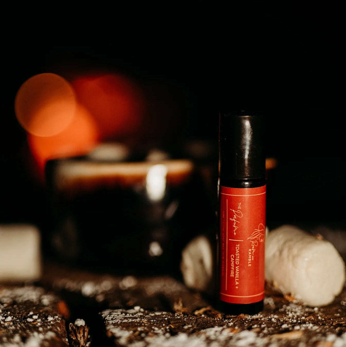 Red bottle with black cap on a dark background