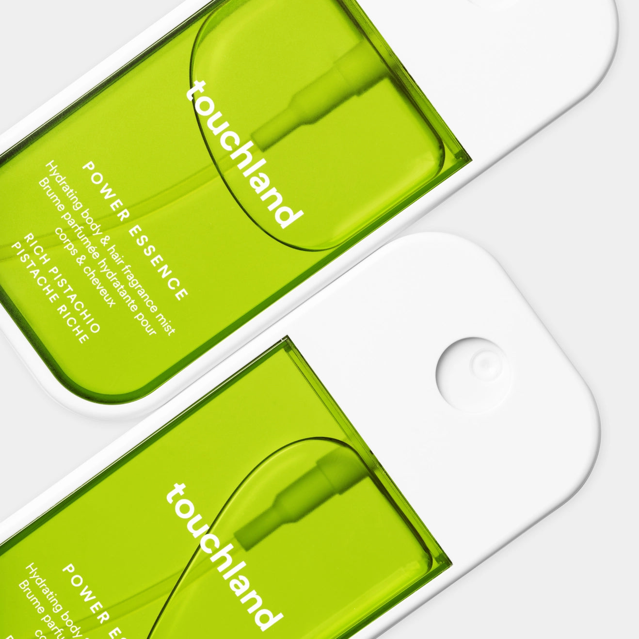 Two green packages of touchland Power Essence on a white background