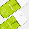 Two green packages of touchland Power Essence on a white background