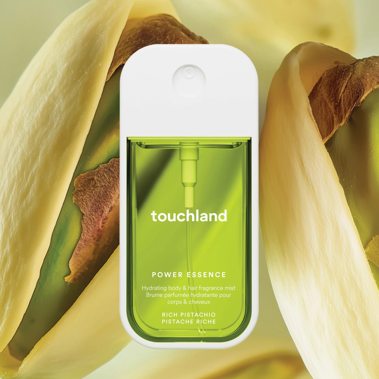 Touchland power essence bottle with pistachio shell background