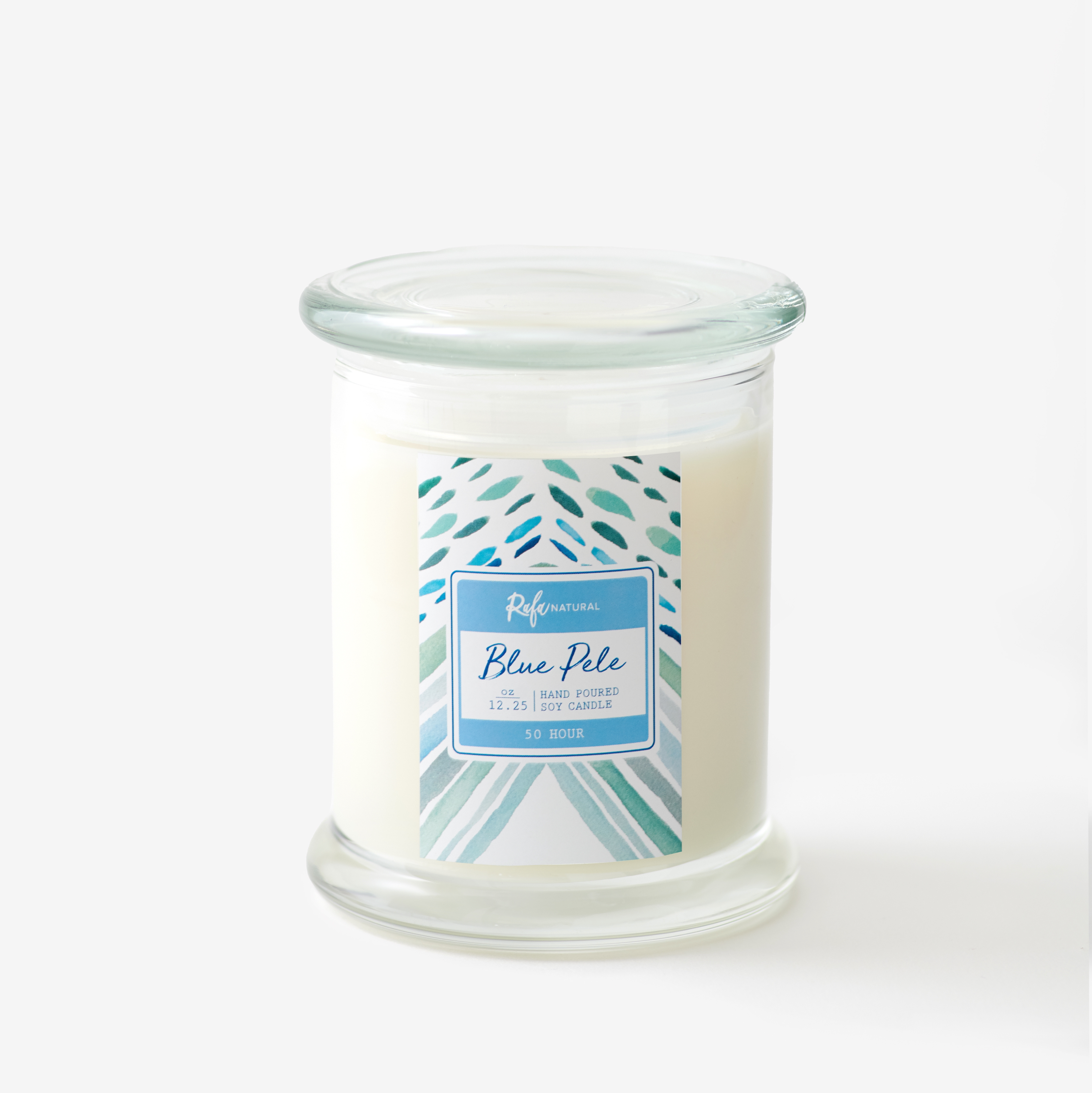 Blue Pele 50hr soy candle in clear glass jar with tropical blue label and creamy white wax